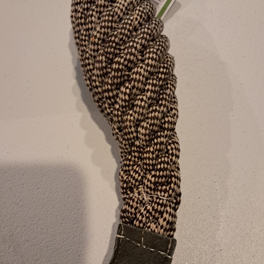 a braided rope dog toy, commonly used for chewing, fetching,